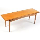 A 1970's teak coffee table, 115 x 40 x 42cms high.