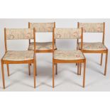 A set of four 1980's teak dining chairs,