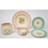 Susie Cooper, Crown Works, Burslem: a dinner service, pink border with central floral decoration,