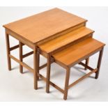 A nest of three teak rectangular occasional tables, the largest 66 x 42 x 49cms high.