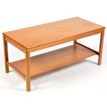 MacIntosh Furniture: a teak coffee table, the rectangular top above an undertier,