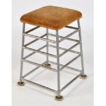 A steel frame stool, industrial style, with suede upholstered top, 75cms high.