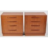 G-Plan: a pair of teak chests of four long drawers, 70 x 44 x 73cms high.