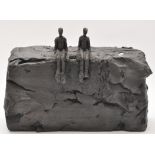 Carol Peace: a black glaze pottery sculpture of two figures sitting on a cliff,