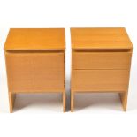 Meredew Furniture: a pair of light stained oak bedside cabinets, one fitted a hinged door,