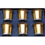 Skultuna, Sweden: a set of six forgylld (gilt) pewter cups, in original box, cups 6.5cms high.