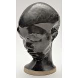 Devon Pottery: head study of an African girl, 'Devon, Dartmouth, England' marks to base,
