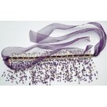 Hoorieh Coish: an amethyst, silver and purple ribbon fringe necklace, the main drop 30cms long.