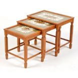 A nest of three teak tile top tables, c.1980's, 52 x 37 x 46cms high.