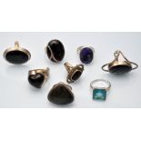 Eight single stone gem set rings including onyx.