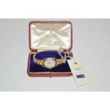 A 9ct. yellow gold Record watch with flexible strap, in fitted case.