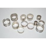 Napkin rings, mainly silver,