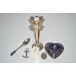 A silver flared vase; a heart-shaped silver mounted pin cushion; an anchor pattern brooch;