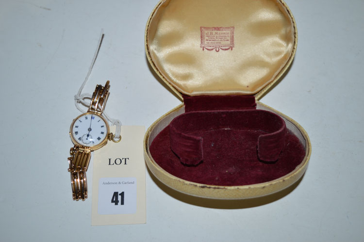 A 15ct yellow gold cased cocktail watch, white enamel roman dial with subsidiary seconds aperture,