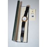 A 9ct. yellow gold cased Longines wristwatch with white enamel roman dial, fitted later strap.