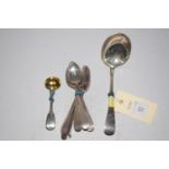 Nine Georgian silver teaspoons; a silver tablespoon (bowl bent round to form a ladle);