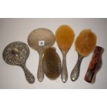 Silver backed dressing table hand mirrors; brushes; comb; etc.