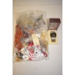 A large quantity of costume jewellery; and a costume watch.