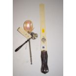 A Victorian ivory and silver handled page-turner; a mother-of pearl sifting spoon with metal handle;