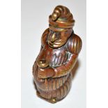 An Edwardian cold painted brass Mr. Punch pattern vesta case, painted in brown, some rubbed, 6cms.