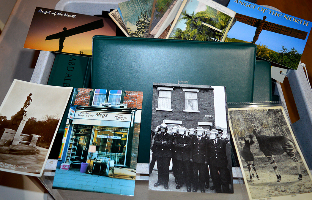 A large quantity of postcard albums and slips; together with a small quantity of postcards,