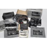 A Rollei 35S compact camera (black) with pouch case and original box;