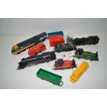 A quantity of Hornby 00 locomotives and other train items.