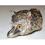 A plated metal Edwardian vesta case in the form of a fox head, fitted glass eyes (one missing),