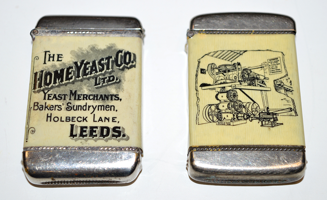 Two plated metal vesta cases advertising the Home Yeast Co. Ltd.