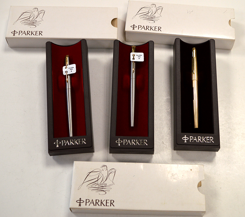 Three Falcon Parker fountain pens, two in steel cases one in gold plated case, all boxed.