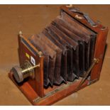 An early 20th Century mahogany half-plate camera,