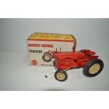 A Lesney Massey-Harris tractor, red with cream hubs, boxed.