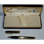 A Sheaffer Targa fountain pen, in gold electroplated case, fitted 14ct. gold nib, cased.