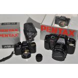 A Pentax P30 SLR camera fitted SMC 50mm f2 lens in box;