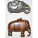 Two Edwardian vesta cases, one pewter in the form of an elephants head set tusks (missing one),