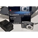 A Panasonic Lumix TZ4 digital compact camera; with accessories and original box.