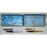 Two lady Sheaffer fountain pens, one in gold plated case with zigzag decoration,