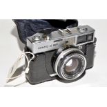 An Olympus 35SP rangefinder camera, fitted fixed Zuiko 42mm f1.7 lens in leather case.