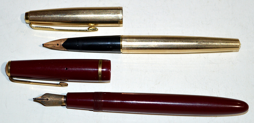 A Parker 585 fountain pen in maroon plastic case, fitted 14ct.