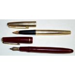 A Parker 585 fountain pen in maroon plastic case, fitted 14ct.