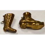 Two Edwardian brass vesta cases, one with hinged heel and studded sole, 5.5cms., the other 4.5cms.