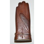 An Edwardian vesta case in the form of a glove, brown leather covered, 6.5cms.