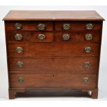 A George III mahogany chest of four short and three long graduating drawers fitted later embossed