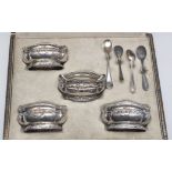 A set of four French silver table salts, shaped oval form, decorated with beads and bows,