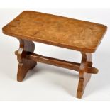 Thomas "Gnomeman" Whittaker: an adzed oak stool, the rectangular top on shaped supports,