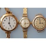 Rotary: a lady's 9ct. gold wristwatch, with 9ct. bracelet strap; Rolex: a 9ct.