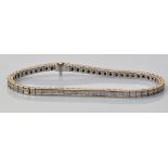 A diamond line bracelet, the baguette cut diamonds mounted in channel setting,