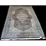 A Tabriz carpet, with shaped floral decorated field around a central medallion,
