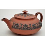 Wedgwood 'Rosso Antico' squat teapot and cover, the sides with inverted pendant scrolls, length 25.