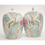 Pair of Chinese Famille Rose ovoid vases and covers,